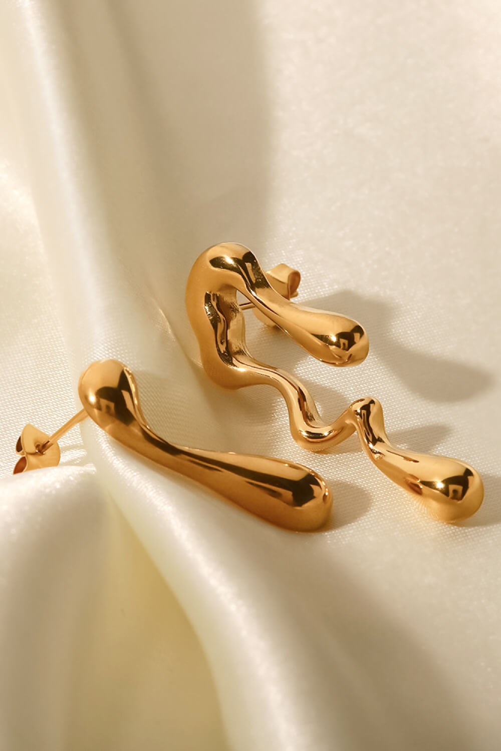 asymmetrical geometric gold hoops