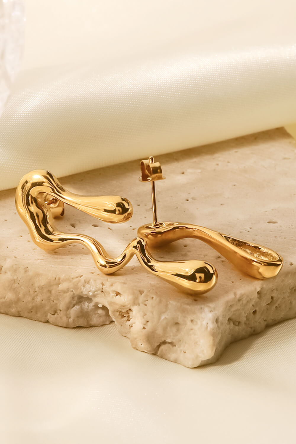 asymmetrical geometric gold hoops