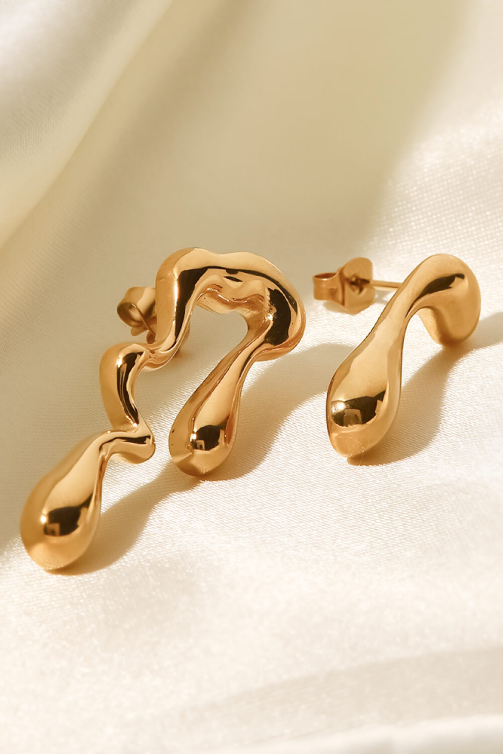 asymmetrical geometric gold hoops