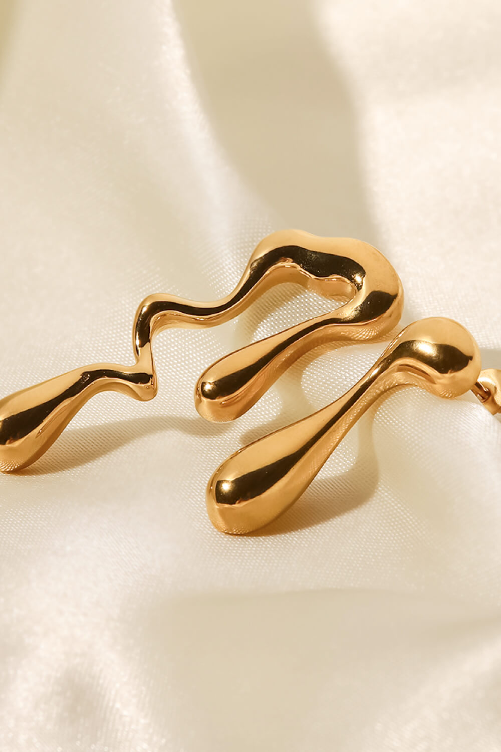 asymmetrical geometric gold hoops