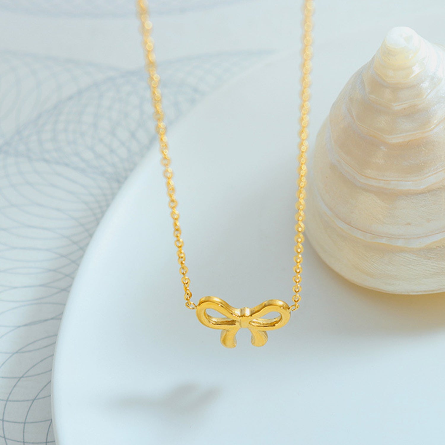 gold bow pendant necklace