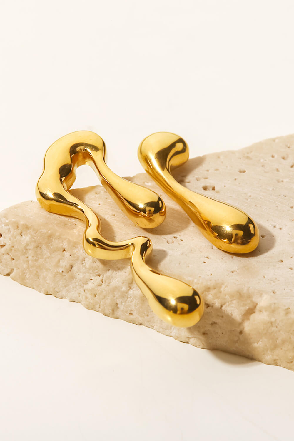 asymmetrical geometric gold hoops