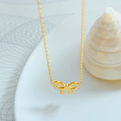 gold bow pendant necklace