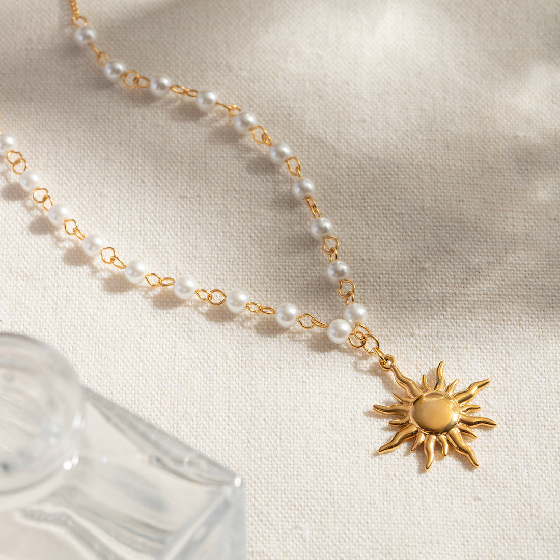 gold pearl sun pendant